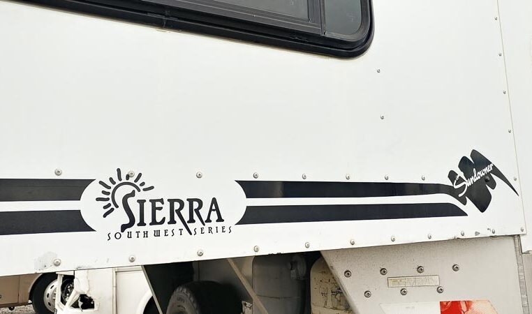 View of the Decals in a 1999 Sundowner Horse Trailer at Luxury Coach