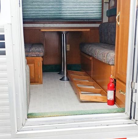 View of the Main Entry in a 1999 Sundowner Horse Trailer at Luxury Coach