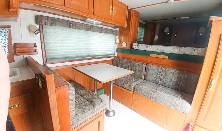 View of the Dining Area in a 1999 Sundowner Horse Trailer at Luxury Coach