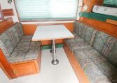 View of the Dinette in a 1999 Sundowner Horse Trailer at Luxury Coach