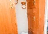 View of the Toilet in a 1999 Sundowner Horse Trailer at Luxury Coach