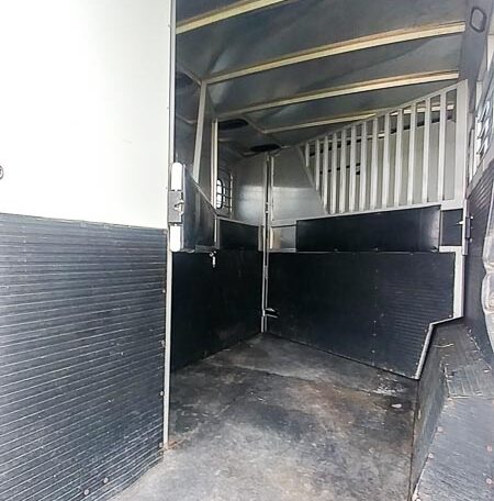 View of the in head stall in a 1999 Sundowner Horse Trailer at Luxury Coach
